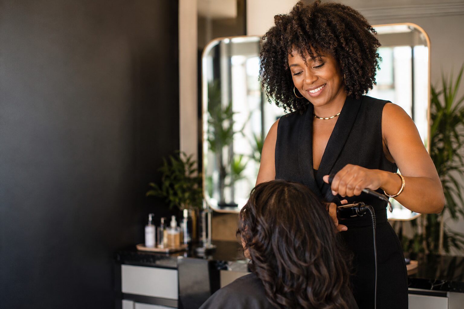 Independent salon professional styling a client's hair
